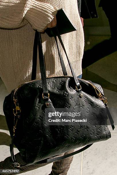 Actress and singer Selena Gomez, Louis Vuitton handbag detail, arrives at Charles-de-Gaulle airport during the Paris Fashion Week Fall Winter...