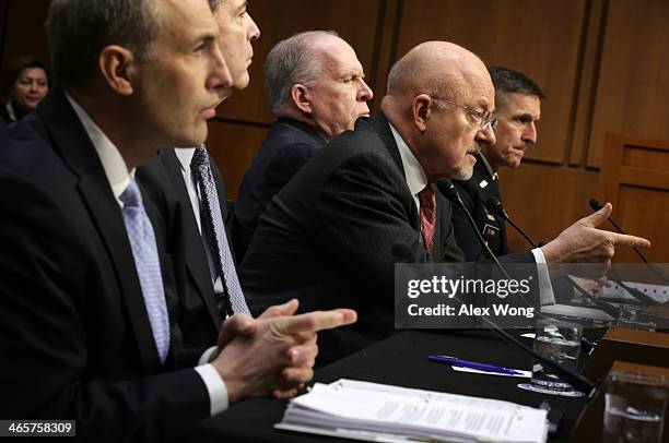 National Counterterrorism Center Director Matthew Olsen, FBI Director James Comey, Director of National Intelligence James Clapper, CIA Director John...