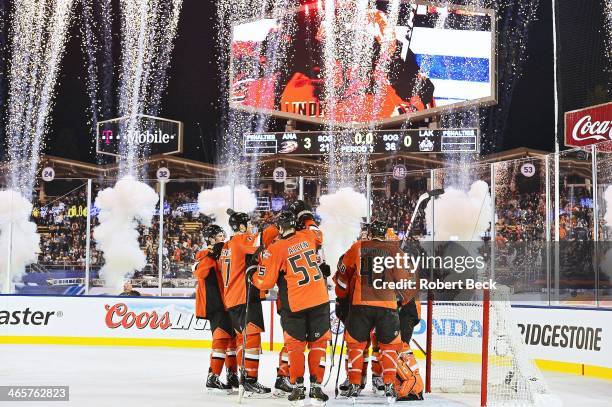 Stadium Series: Anaheim Ducks players victorious after winning game vs Los Angeles Kings at Dodger Stadium. Los Angeles, CA 1/25/2014 CREDIT: Robert...