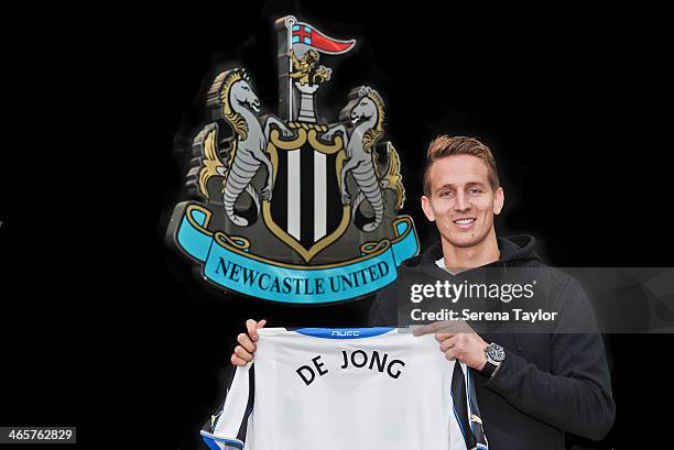 New Signing Luuk de Jong holds his shirt in front of the Club Crest at St.James' Park on January 29 in Newcastle upon Tyne, England.