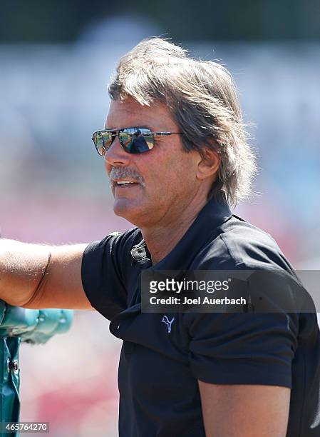 Dennis Eckersley, member of the Baseball Hall of Fame watches the Boston Red Sox warm up prior to their spring training game against the St Louis...