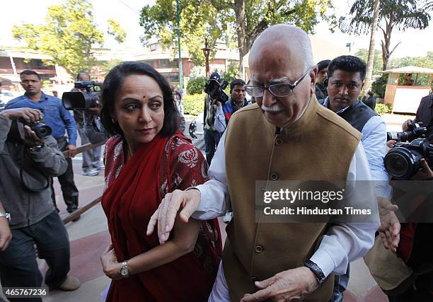 Leaders LK Advani with Hema Malini at Parliament House during budget session on March 10, 2015 in New Delhi, India. Facing stiff opposition over the...