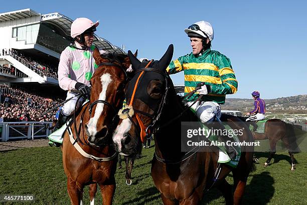 Ruby Walsh riding Faugheen are congratulated by Tony McCoy after winning The Stan James Champion Hurdle at Cheltenham racecourse on March 10, 2015 in...