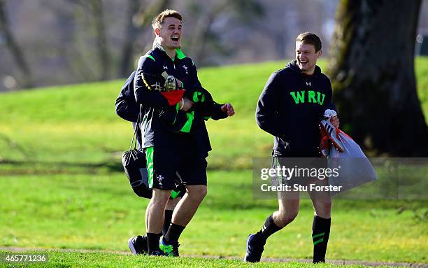 Wales players Jonathan Davies enjoys a joke with Dan Biggar as they make their way to Wales open training ahead ahead of saturday's RBS Six Nations...