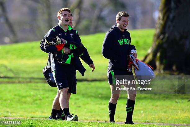 Wales players Jonathan Davies enjoys a joke with Dan Biggar as they make their way to Wales open training ahead ahead of saturday's RBS Six Nations...