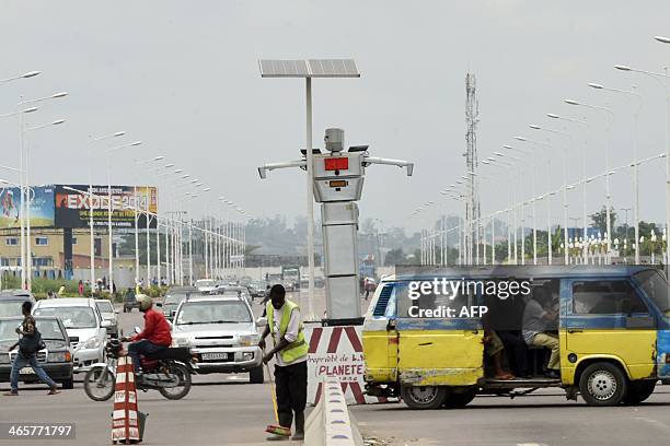 This picture taken on January 22, 2014 shows a traffic robot cop on Triomphal boulevard of Kinshasa at the crossing of Asosa, Huileries and Patrice...