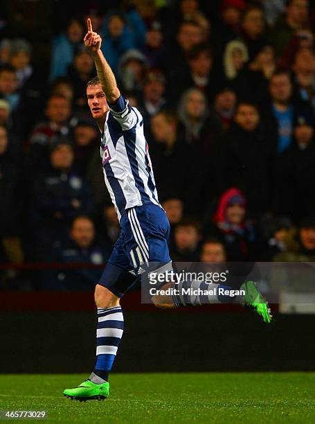 Chris Brunt of West Brom celebrates scoring the opening goal during the Barclays Premier League match between Aston Villa and West Bromwich Albion at...