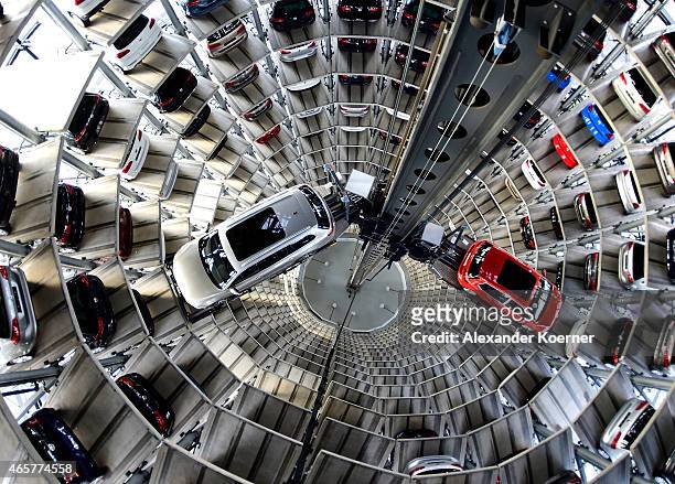 Brand new Volkswagen Passat and Golf 7 car stands stored in a tower at the Volkswagen Autostadt complex near the Volkswagen factory on March 10, 2015...
