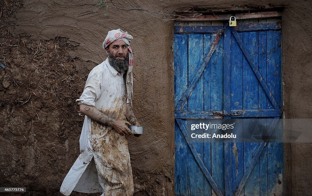 Refugees live under harsh conditions at the village in Islamabad