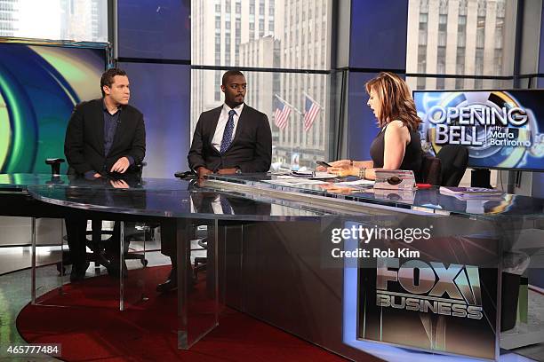 Host Maria Bartiromo with football player Plaxico Burress and penny stock expert Timothy Sykes appear on "Opening Bell With Maria Bartiromo" on the...