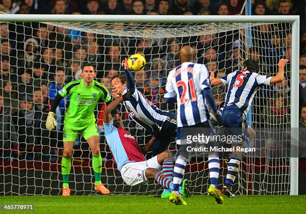 Foul by Diego Lugano of West Brom on Christian Benteke of Aston Villa to concede a penalty during the Barclays Premier League match between Aston...