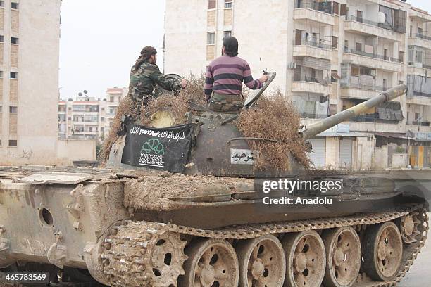 Troops from the Islamic Front clash with soldiers of Assad regime in an attack to the Nayrab military airport on January 26, 2014 in Aleppo, Syria.