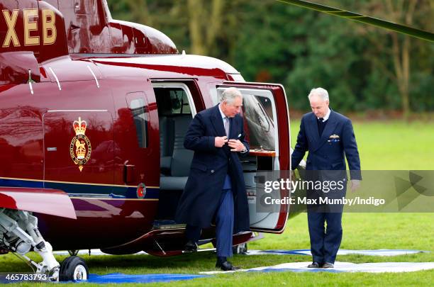 Prince Charles, Prince of Wales disembarks a Sikorsky Helicopter as he and Camilla, Duchess of Cornwall arrive for a visit to The Bell pub during a...