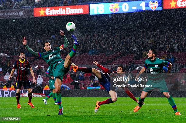 Marc Bartra of FC Barcelona duels for the ball with Juanfran and Vyntra of Levante UD during the Copa del Rey Quarter Final 2nd leg match between FC...