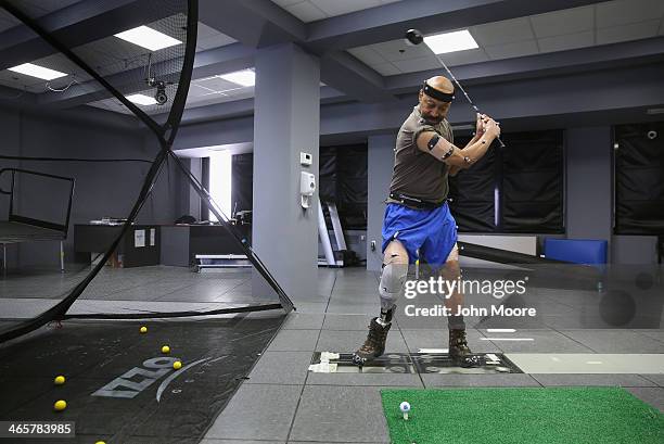 Military veteran and amputee Lloyd Epps swings a driver while at the gait and motion analysis lab at the Veterans Administration , hospital on...