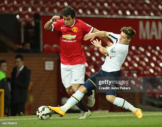 Rafael da Silva of Manchester United U21s in action with Will Miller of Tottenham Hotspur U21s during the Barclays U21 Premier League match between...