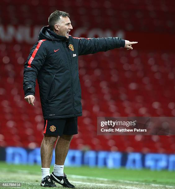 Manager Warren Joyce of Manchester United U21s watches from the touchline during the Barclays U21 Premier League match between Manchester United and...