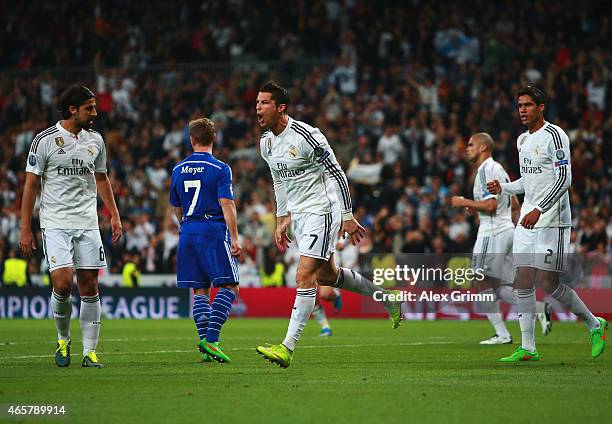 Cristiano Ronaldo of Real Madrid CF celebrates as he scores their first and equalising goal during the UEFA Champions League Round of 16 second leg...