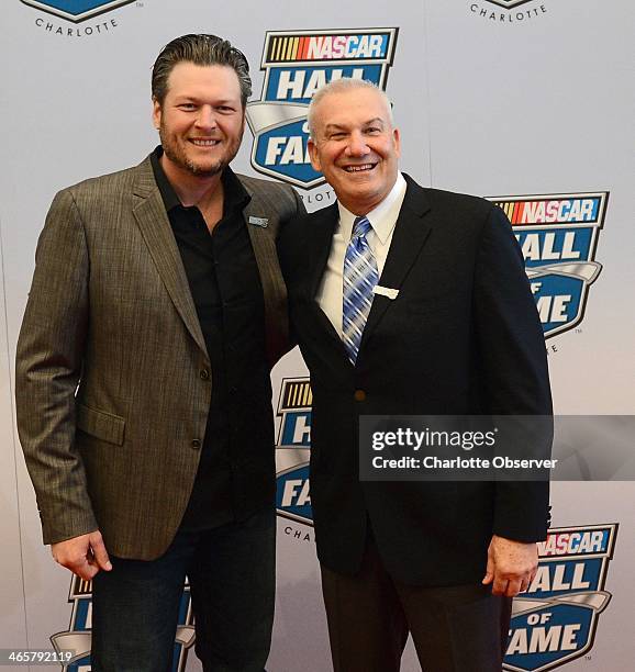 Country music singer Blake Shelton, left, poses with NASCAR Hall of Fame inductee Dale Jarrett during the NASCAR Hall of Fame Induction Ceremony in...