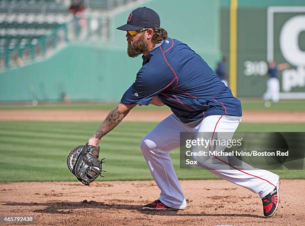 Mike Napoli of the Boston Red Sox fields a ground ball during warm ups before a Grapefruit League game against the Miami Marlins at jetBlue Park in...