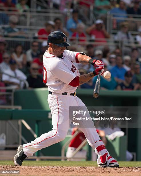 Humberto Quintero of the Boston Red Sox bats during the fifth inning of a Grapefruit League game against the Miami Marlins at jetBlue Park in Fort...