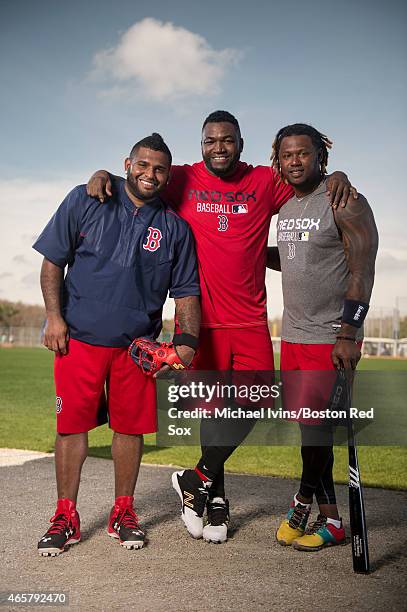 Pablo Sandoval, David Ortiz and Hanley Ramirez of the Boston Red Sox pose for a photograph at jetBlue Park in Fort Myers, Florida on February 24,...