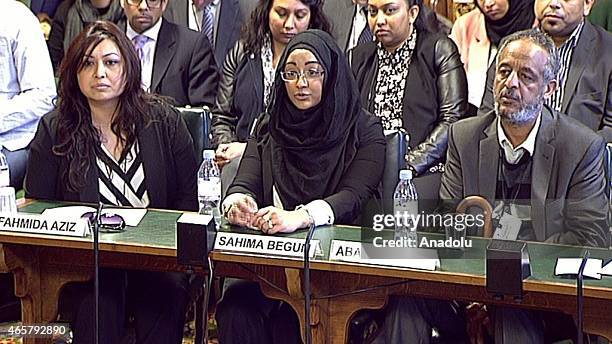 In this photo taken from video, Kadiza Sultana's Cousin Fahmida Aziz , Shamima Begum's sister Sahima Begum and Amira Abase's father Hussen Abase...