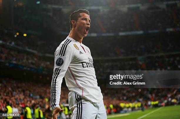 Cristiano Ronaldo of Real Madrid CF celebrates as he scores their second goal during the UEFA Champions League Round of 16 second leg match between...