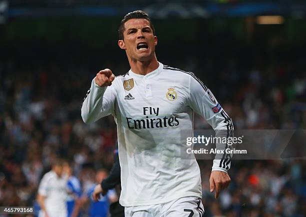 Cristiano Ronaldo of Real Madrid CF celebrates as he scores their second goal during the UEFA Champions League Round of 16 second leg match between...