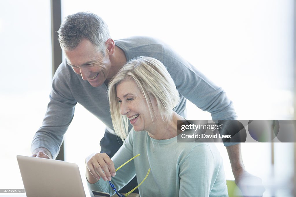 Couple shopping online with credit card