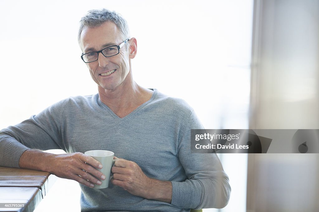 Man relaxing with cup of coffee