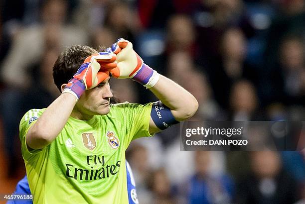 Real Madrid's goalkeeper and captain Iker Casillas gestures during the round of 16 second leg UEFA Champions League football match Real Madrid CF vs...
