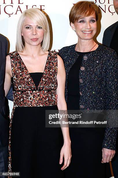 Michelle Williams and Kristin Scott Thomas attend the world premiere of "Suite Francaise" at Cinema UGC Normandie on March 10, 2015 in Paris, France.