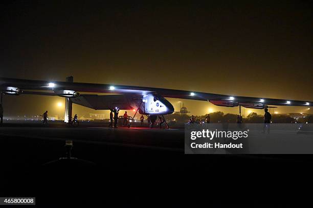 In this handout image supplied by Jean Revillard, Solar Impulse 2, a solar-powered airplane piloted by Bertrant Piccard, is shown after landing March...