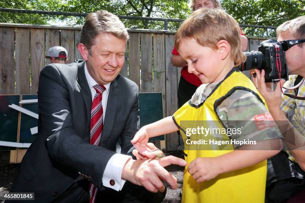 Labour leader David Cunliffe and Ryder Austin play with a cicada during a visit to Trentham Kindergarten to discuss his party's Best Start package on...