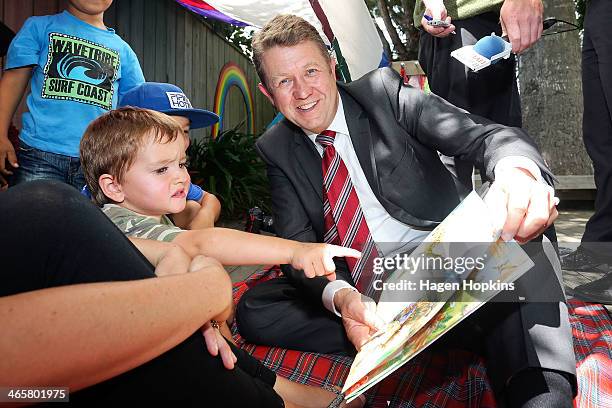 Labour leader David Cunliffe reads a book while Ryder Austin looks on during a visit to Trentham Kindergarten to discuss his party's Best Start...