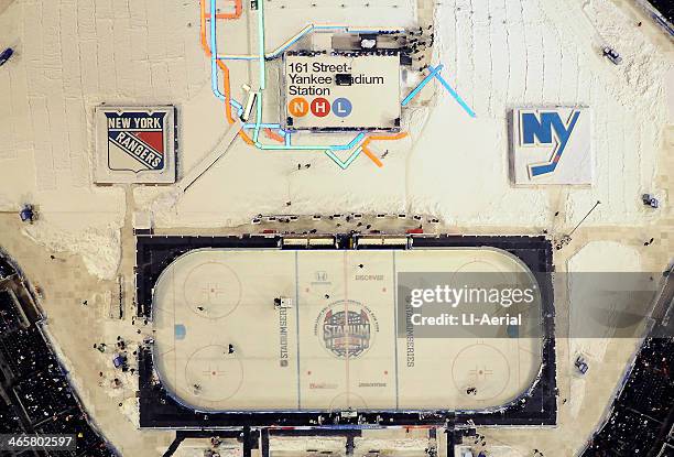 Night aerial view of a 2014 Coors Light NHL Stadium Series game between the New York Rangers and the New York Islanders at Yankee Stadium on January...