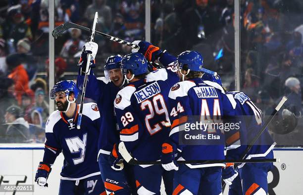 Brock Nelson of the New York Islanders celebrates his second period goal with the New York Rangers during the 2014 Coors Light NHL Stadium Series at...