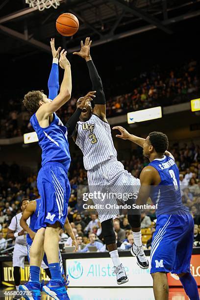 Central Florida's Isaiah Sykes goes up to the basket against Memphis' Austin Nichols during first-half action at the CFE Arena in Orlando, Fla. On...