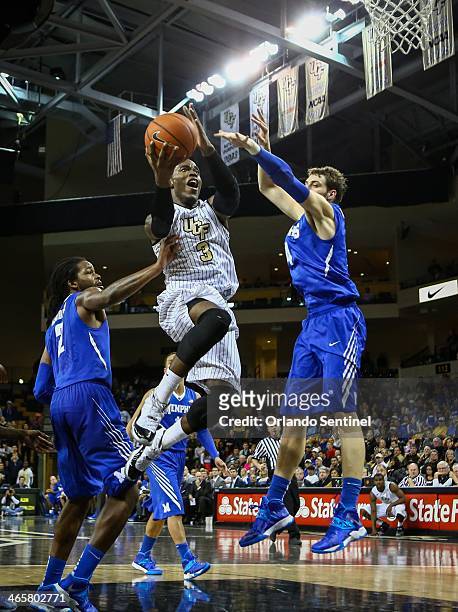 Central Florida's Isaiah Sykes goes up to the basket against Memphis during second-half action at the CFE Arena in Orlando, Fla. On Wednesday, Jan....