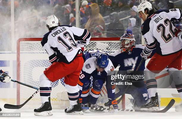 Daniel Carcillo of the New York Rangers scores a third period goal against Evgeni Nabokov of the New York Islanders during the 2014 Coors Light NHL...