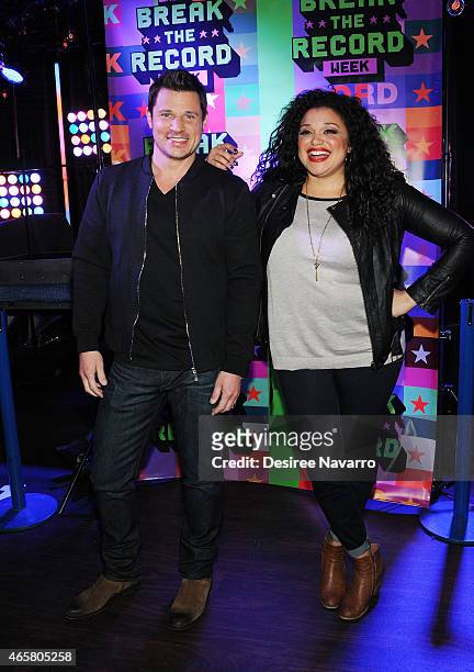 Singer Nick Lachey and actress Michelle Buteau attend the 2015 MTV Break the Record Week - Dance-A-Thon at Times Square on March 10, 2015 in New York...