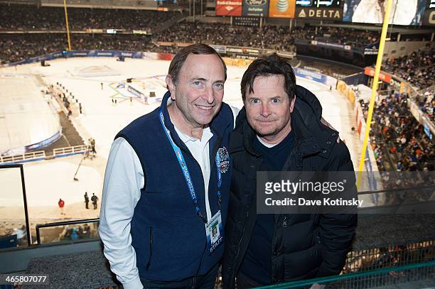 Commissioner Gary Bettman and Michael J. Fox attend the 2014 NHL Stadium Series at Yankee Stadium on January 29, 2014 in New York City.