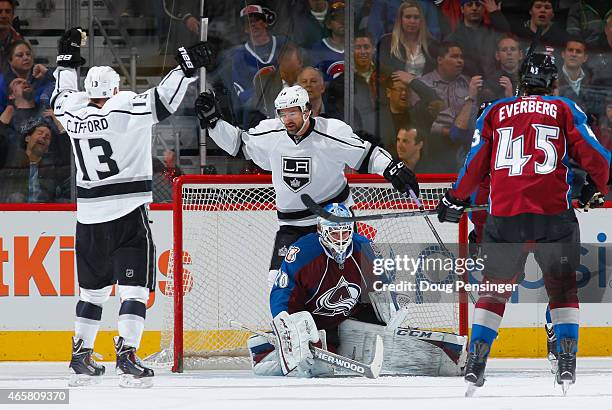 Kyle Clifford of the Los Angeles Kings celebrates his goal against goalie Reto Berra of the Colorado Avalanche with teammates Justin Williams of the...