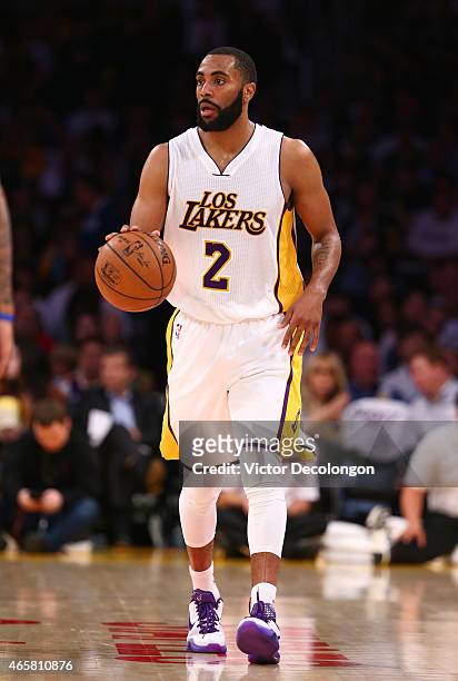 Wayne Ellington of the Los Angeles Lakers dribbles the ball upcourt in the second half during the NBA game against the Dallas Mavericks at Staples...