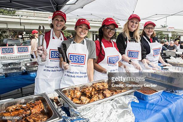 Volunteers serve food to U.S. Troops at Bob Hope USO at LAX on March 10, 2015 in Los Angeles, California.