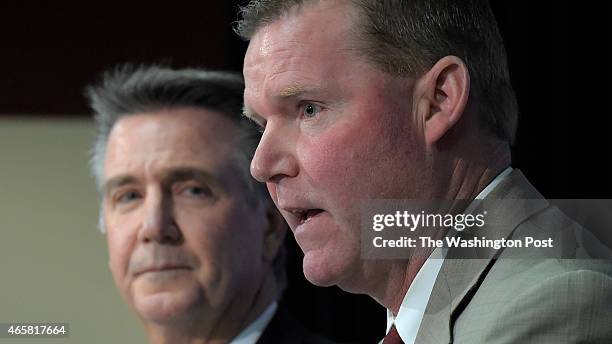 Redskins' team President Bruce Allen listens to Scot McCloughan as he is introduced as the Redskins new General Manager during press conference at...