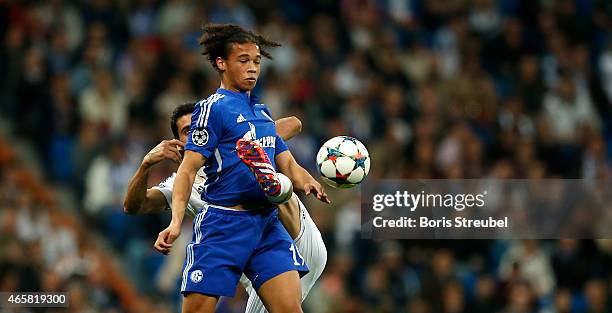 Alvaro Arbeloa of Real Madrid challenges Leroy Sane of Schalke during the UEFA Champions League Round of 16 second leg match between Real Madrid CF...