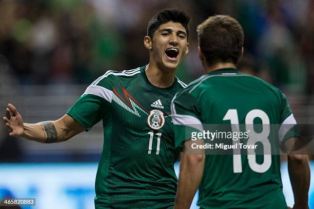 Alan Pulido of Mexico celebrates his second goal with Isaac Brizuela during a FIFA friendly match between Mexico and South Korea at Alamodome Stadium...