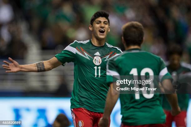 Alan Pulido of Mexico celebrates his second goal with Isaac Brizuela during a FIFA friendly match between Mexico and South Korea at Alamodome Stadium...